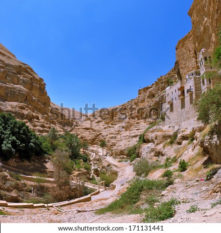 The famous monastery of St. George the Victorious in Wadi Kelt near Jerusalem. To the temple is a long winding path. Photo taken by lens Fisheye.