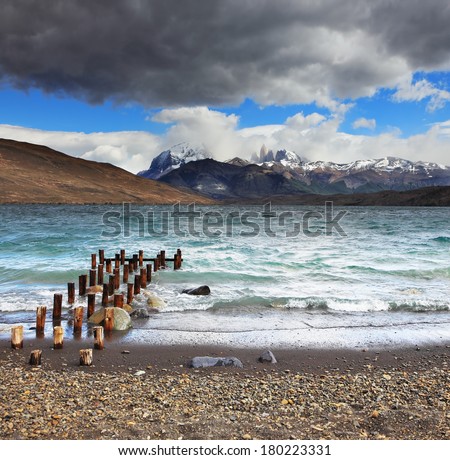 Storm clouds and strong winds in Laguna Azul. Boat dock on the lake. National Park Torres del Paine in Patagonia, Chile