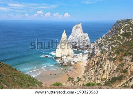 Two picturesque cliffs of white sandstone, resembling a portion of ice cream. Atlantic coast of Portugal