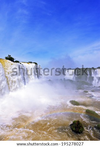 The most high-water waterfall in the world - Iguazu. Boiling water foam, crashing and falling jets, a fine mist over the water. The Brazilian side