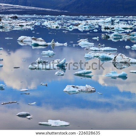 Transparent icebergs and ice floes in the Ice Lagoon Jokulsarlon. South-east Iceland in July