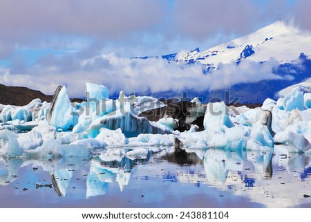 The Arctic Ocean. Iceland. Floating ices reflected in the lagoon  Yokulsarlon