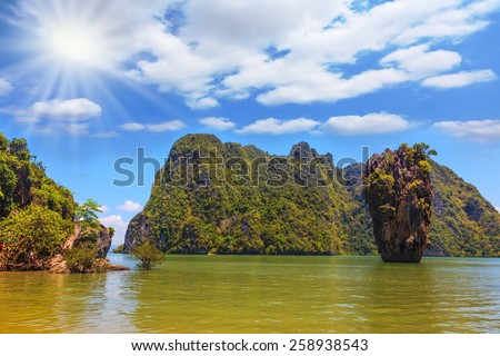 Bright spring sun. Warm Andaman Sea and the quaint island. Exotic vacation in Thailand