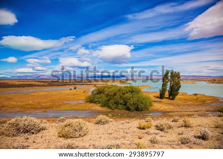Argentine Patagonia in February. Yellow flat scorched desert with shallow lakes