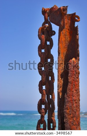 A massive rusty circuit on a rusty metal column in port Caesarea
