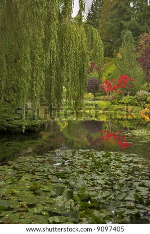 Lake and trees in well-known gardens Butchart Gardens on island
