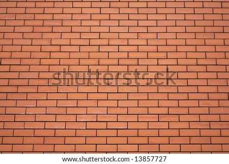 Wall ideally laid out by red bricks in a cathedral in Madrid