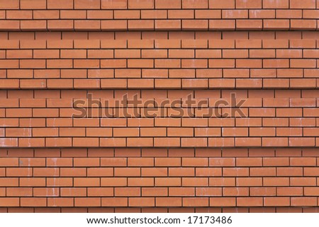 Wall of a cathedral ideally laid out by red bricks in Madrid