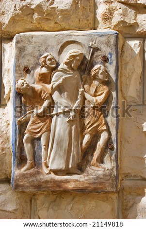 A relief with Jesus Christ\'s image on a wall of Church of all people in Jerusalem