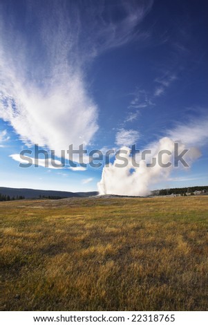 The most well-known of the world geyser in Yellowstone national park - Old Faithful. The beginning of eruption