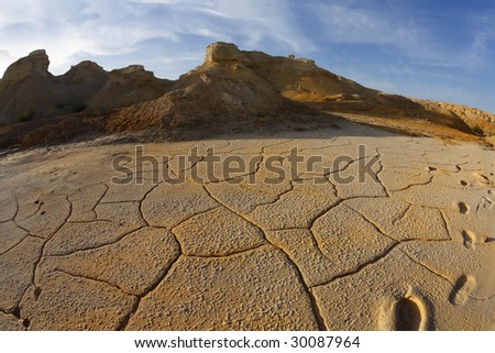 Ancient mountains and the dry ground in desert of Israel, photographed by an objective \