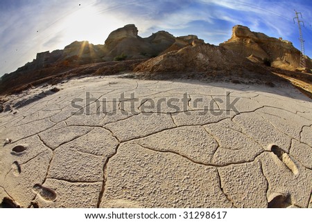 Ancient mountains and the dry ground in desert of Israel, photographed by an objective \