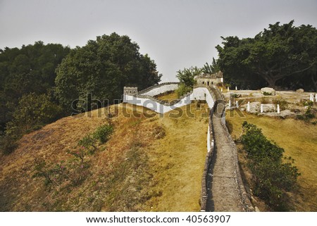 The reduced copy of the Great Chinese wall in the Chinese park of entertainments