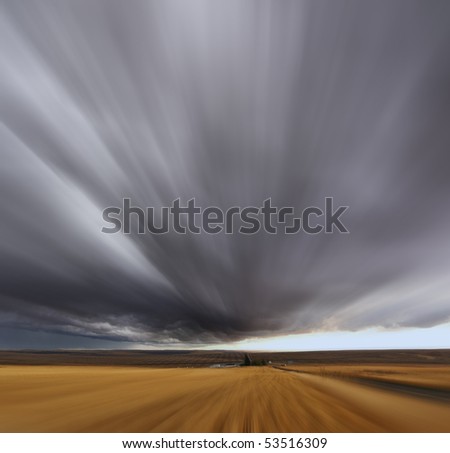 Thunderstorm above fields after harvesting. A Mirage on high speed. Montana, the USA