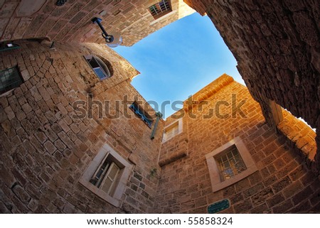 The ancient small city Jaffo on the bank of Mediterranean sea, in  lens \