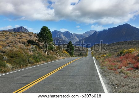 The road went off. Great American road goes through the scenic desert and mountain