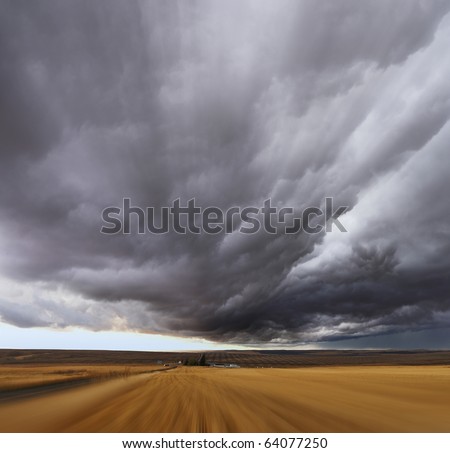 Thunderstorm above fields after harvesting.  A Mirage on high speed