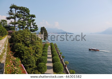 Tourist boat sails past the island of Isola Bella on Lake Maggiore