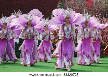 SHENZHEN, CHINA - JANUARY 22: Dance group of girls in beautiful costumes that were at the concert January 22.2009 in Folk Culture Village, Shenzhen, China. Chinese New Year parade.