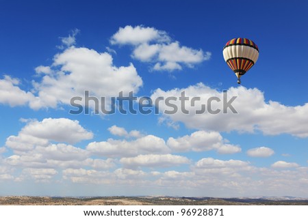 Huge air balloon flies over the earth