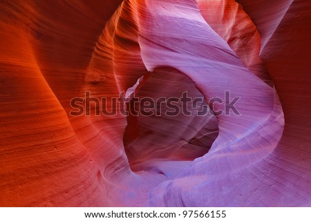 Midday in a red-orange  Antelope Canyon. The play of light, colors and shades gives rise to freakish associations