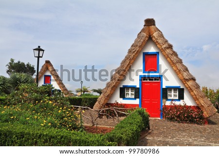 Pastoral landscape. Two charming rural houses with triangular thatched roof. Madeira, the city of Santana
