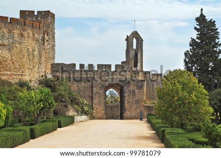 The entrance to the fortress of the Knights Templar. Fortress protective wall surrounding the dilapidated medieval castle Templar