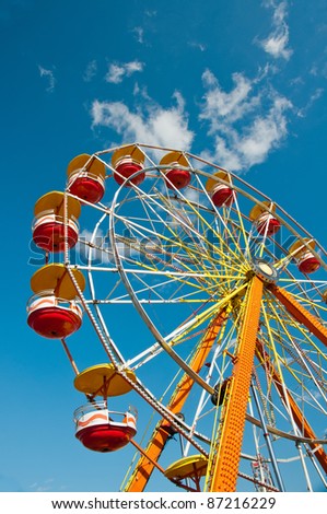 Ferris wheel with blue sky in background.Colorful ferris wheel at carnival in North Carolina