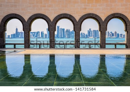 Doha Skyline Through The Arches Of The Museum Of Islamic Art, Doha, Qatar