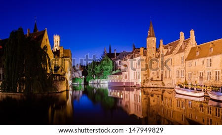 River canal and medieval houses at night, Bruges, Belgium