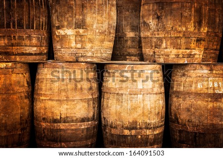 Stacked whisky barrels in monochrome vintage style