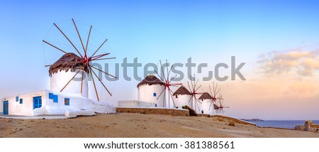 Panoramic view of traditional greek windmills on Mykonos island at sunrise, Cyclades, Greece