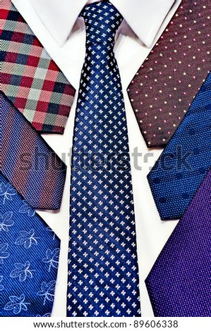 Neck ties stack on a white shirt