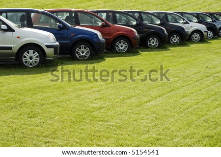 stock photo Row Of Cars On A Lawn