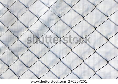 Iron wire fence texture on white Vinyl background.