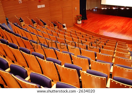 The interior of a theater, the seats and the stage