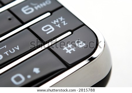 A close up shot of mobile keypad under light