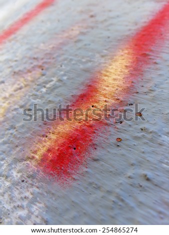 Grey wall with yellow and red detail, Shallow Depth of Field - colourful abstract background