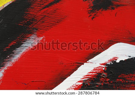 Small part of painted metal wall with  black,red and white paint  - Colourful abstract background-Close up 2