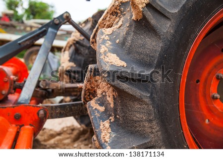 The massive tire of an agricultural machine