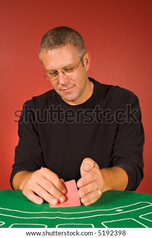 Man looking at hole cards in Texas Hold \'Em poker game