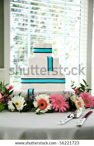 stock photo Modern wedding cake blue teal on white