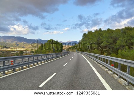 Tunnels on a highway, hilly landscape