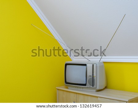 Old, vintage tv set in the corner of the room