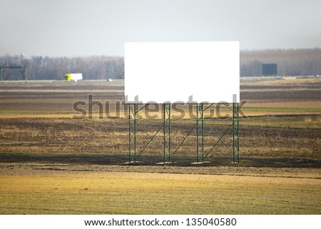 Empty advertisement board next to a highway