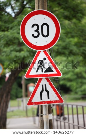 Traffic signs at a road construction site