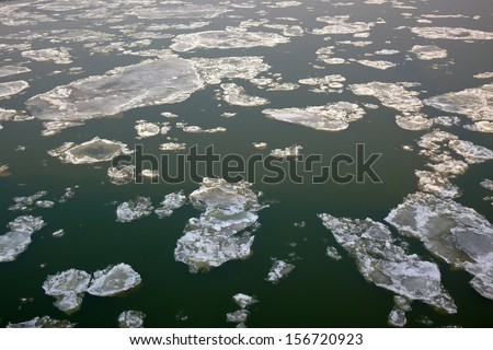 Ice sheets floating on a river