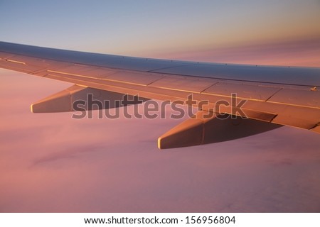 Sunrise view from an aircraft - Never forget to book a seat by the window