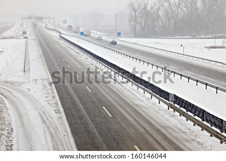 Highway traffic in heavy snowfall