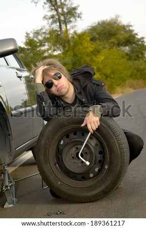 Man with wheel on the road